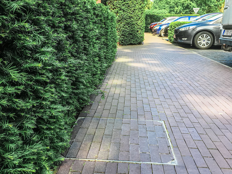 De regenput discreet wegwerken? Perfect geplaatst deksel in 6 stappen