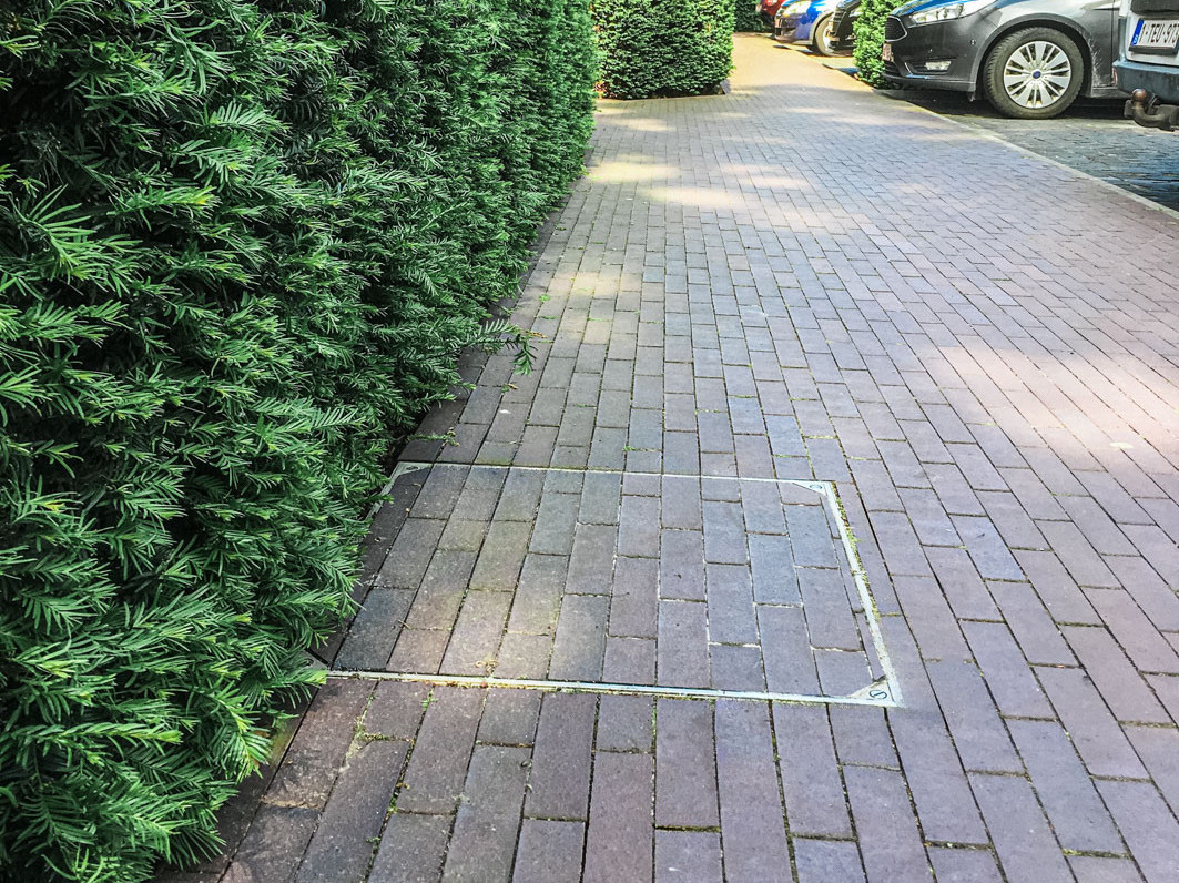 De regenput discreet wegwerken? Perfect geplaatst deksel in 6 stappen