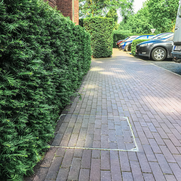 De regenput discreet wegwerken? Perfect geplaatst deksel in 6 stappen