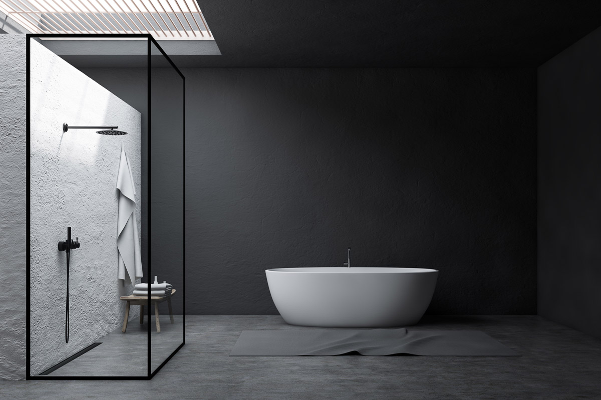 Caniveau de douche ACO noir dans une salle de bain noire avec douche de plain-pied